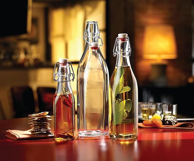 Bormioli Rocco Swing Top Glass Bottle (Set of 4) - Reusable Container with Secure Metal Clasp, Ideal for Homemade Juices, Oil Infusions, Condiments, Mixers - Everyday Drinking Glasses (33.75 Oz.)